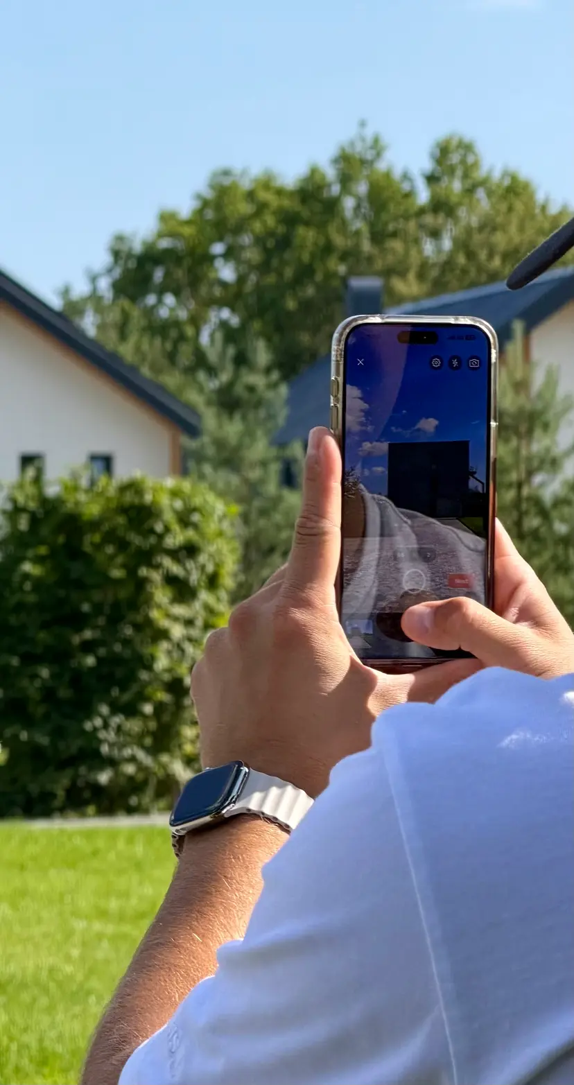 Inspector photographing a property with the MeetInspect mobile app